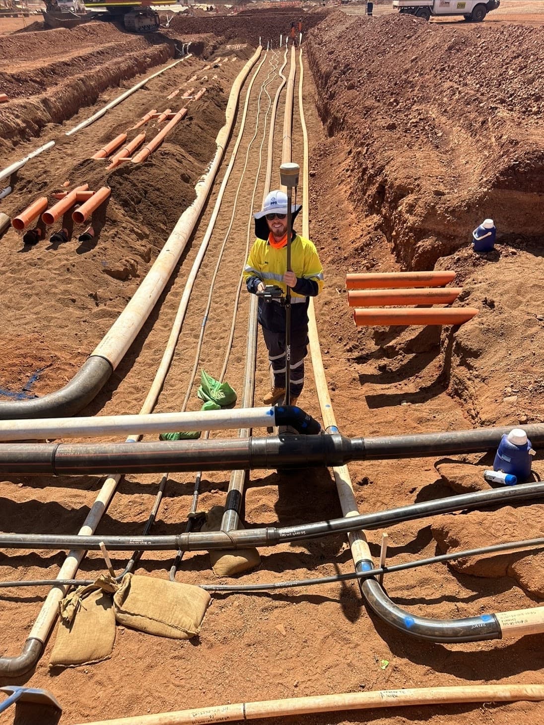 Surveyor conducting as-built survey on a construction site in Western Australia